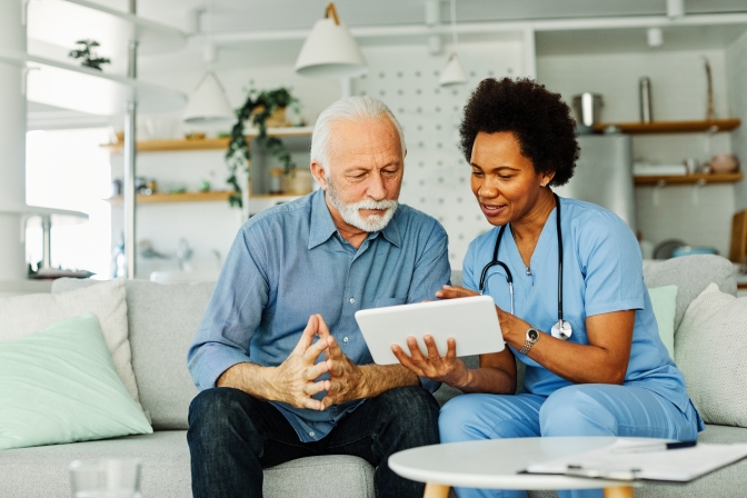 Medical professional explaining what IRMAA is to a patient.