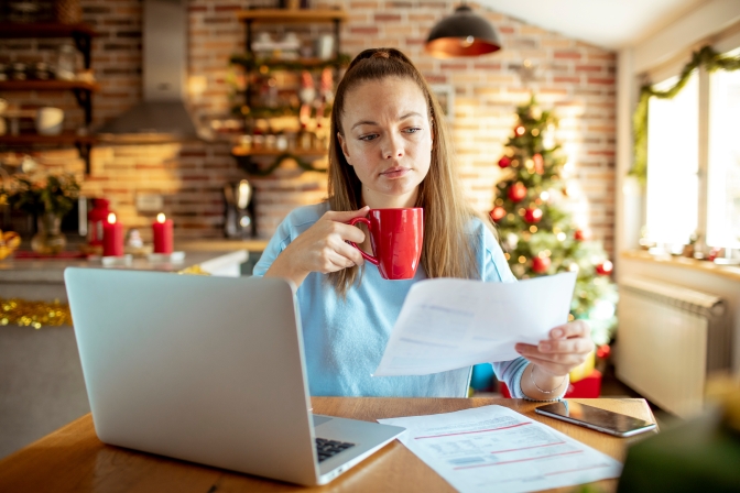 Woman managing financial stress during the holidays