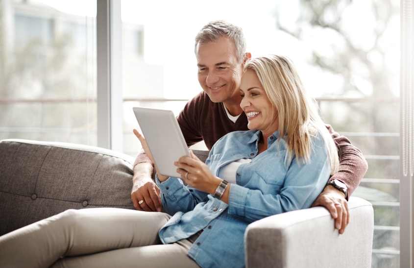 Couple reviewing Q1 2025 insights together via a tablet